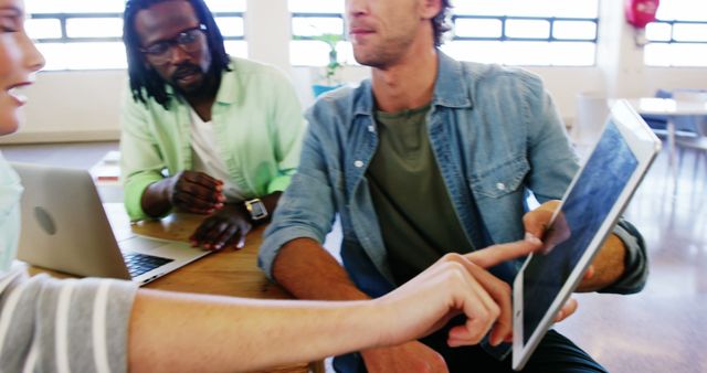 Diverse Young Team Collaborating on Project with Tablet - Download Free Stock Images Pikwizard.com