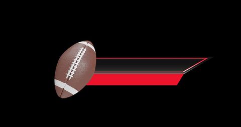 Rugby ball with red ribbon on black background