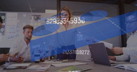 Digital Interface Overlay with Team Collaborating in Business Meeting