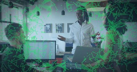 Leading presenter in white shirt gesturing, briefing team in office with green network overlay
