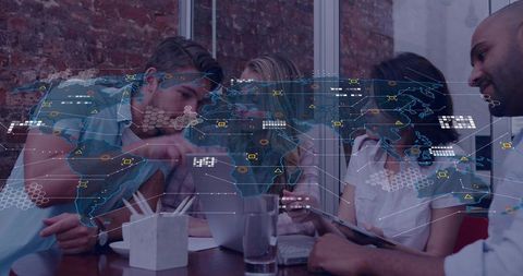 Cross-border team collaborating with augmented reality world map overlay in modern office