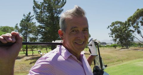 Senior Man Enjoying Golf on a Sunny Day