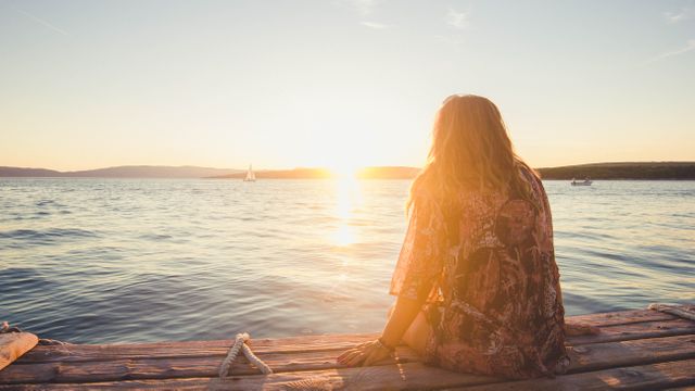 Woman Watching Sunset by Lake on Wooden Deck - Download Free Stock Images Pikwizard.com