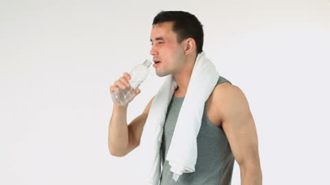Fit Man Hydrating Post-Workout with Towel