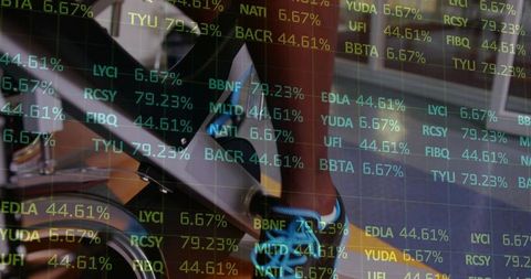 Male pedaling spin bike with blue athletic sneaker and stock market ticker double exposure