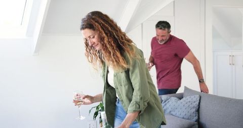 Couple Enjoying Relaxation with Wine in Living Room