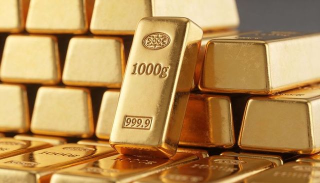 Stacked 1000g 999.9 gold bars leaning on polished bullion pile luxury wealth