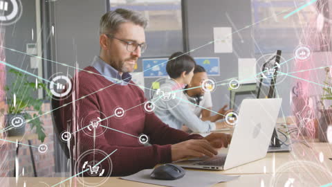 Man Analyzing Data in Networked Office Environment