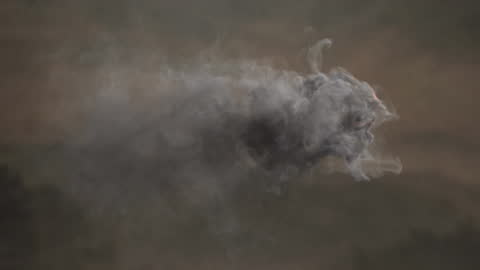 Realistic Smoke Trail Animating Over Rolling Landscape
