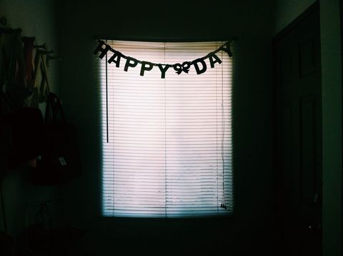 Dimly Lit Room with Happy Birthday Banner