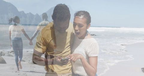 Happy Couple Enjoying Beach and Smartphone Connection