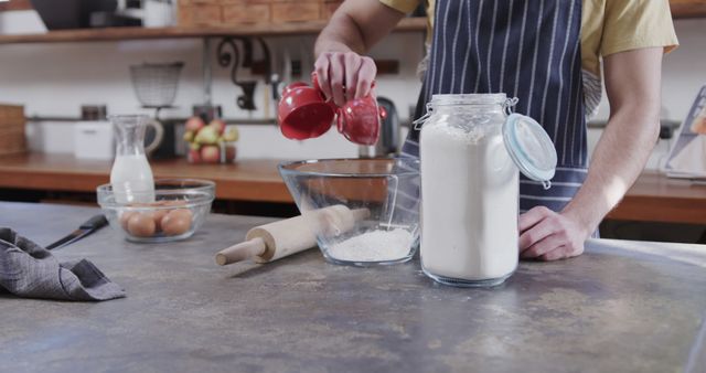 Person Pouring Ingredients in Clear Mixing Bowl in Rustic Kitchen - Download Free Stock Images Pikwizard.com