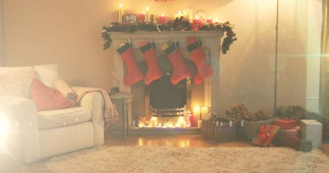 Festive fireplace with christmas stockings and candles
