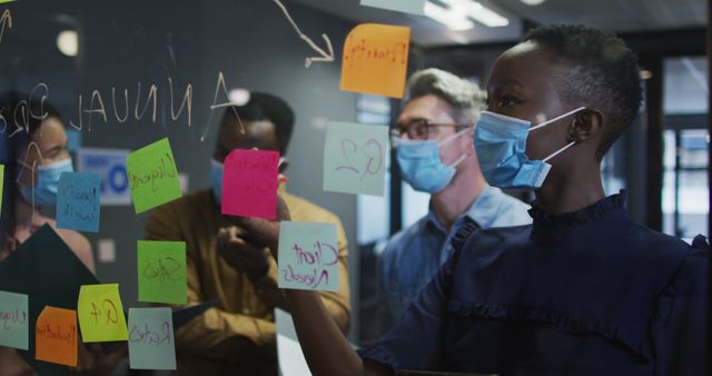 Diverse Colleagues Collaborating on Brainstorming Session with Sticky Notes - Download Free Stock Images Pikwizard.com