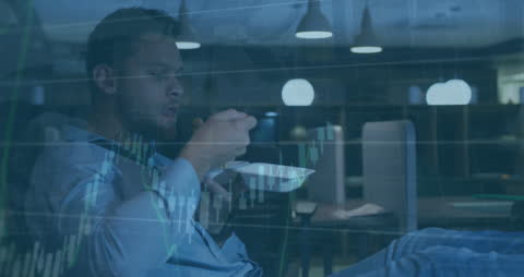 Businessman Eating Midnight Snack with Financial Data Overlay