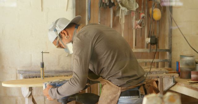 Carpenter Working on Wooden Surfboard in Workshop - Download Free Stock Images Pikwizard.com