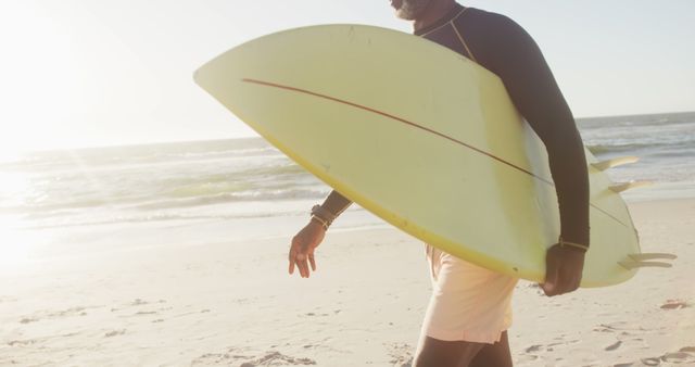 Man Walking on Beach Carrying Surfboard - Download Free Stock Images Pikwizard.com