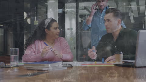 Diverse Coworkers Collaborating in Technologically Enhanced Office