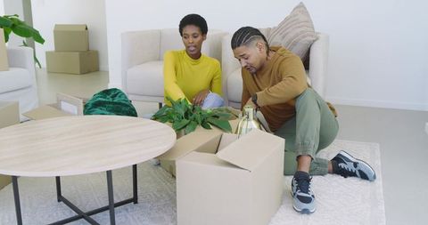 Couple Unpacking Boxes in Modern Living Room Decor