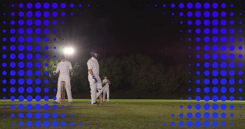 Night cricket batting under floodlights with wicketkeeper, lens flare and blue halftone