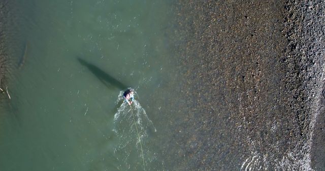 Aerial View of Person Kayaking in Tranquil River Water - Download Free Stock Images Pikwizard.com