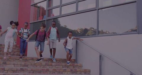 Diverse Group of Friends Walking Down School Stairs Together