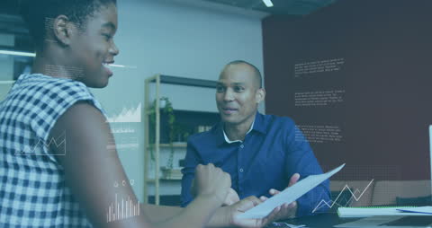 Business Professionals Analyzing Data Charts in Modern Office