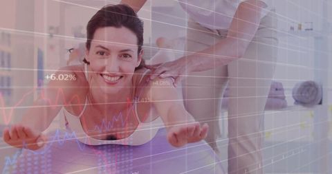 Smiling Woman Doing Physiotherapy Exercises with Therapist's Guidance