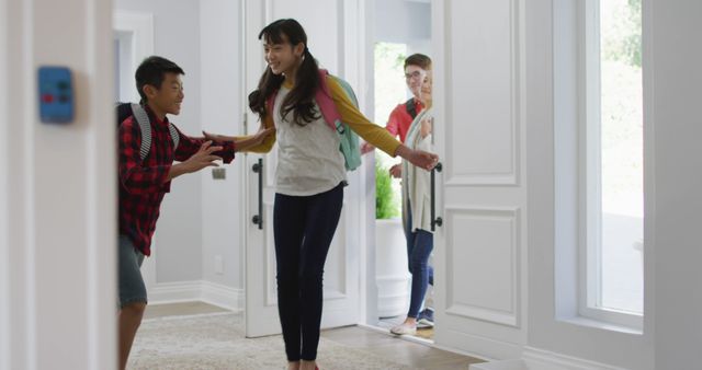 Excited asian son and daughter running through front door, returning home with parents - Download Free Stock Photos Pikwizard.com
