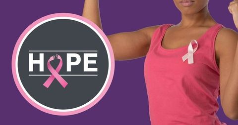 Empowered african american woman with breast cancer ribbon and hope message