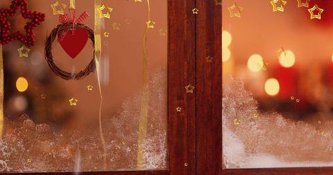 Festive Christmas Window with Stars and Warm Holiday Decor
