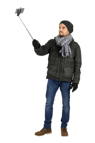 Caucasian Man Holding Selfie Stick with Winter Clothing on Transparent Background - Download Free Stock Videos Pikwizard.com