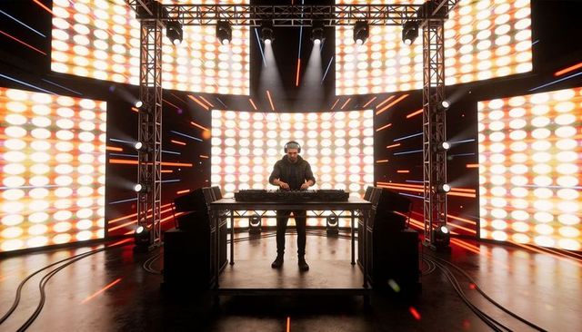 DJ performing on LED stage with mixing console, pulsing lights and concert truss
