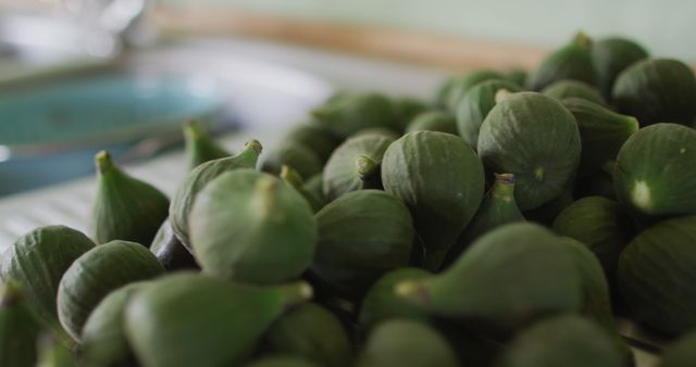 Freshly Harvested Green Figs Piled Together in Kitchen - Download Free Stock Images Pikwizard.com