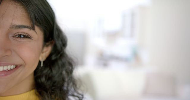 Young Woman Smiling Indoors in Bright, Modern Home - Download Free Stock Images Pikwizard.com