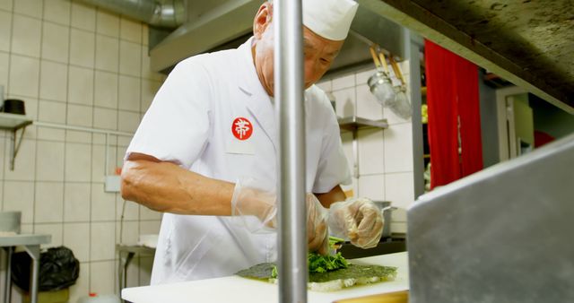 Experienced Sushi Chef Preparing Fresh Sushi Rolls in Professional Kitchen - Download Free Stock Images Pikwizard.com