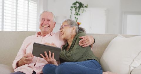 Joyful Senior Couple Using Tablet at Home - Download Free Stock Images Pikwizard.com