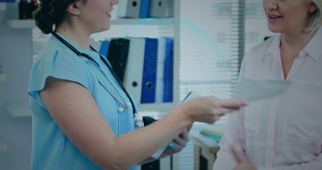 Smiling Female Doctor Consulting Senior Woman in Medical Office - Download Free Stock Images Pikwizard.com