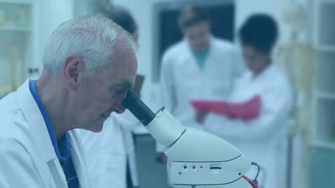 Senior Researcher Using Microscope in Laboratory