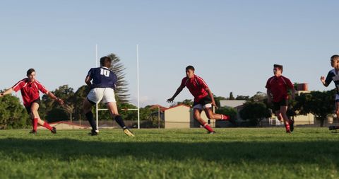 Teenage Rugby Players Competing in Intense Match Outdoors