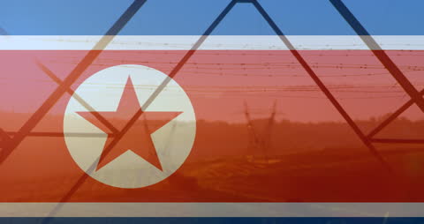 North Korean Flag with Pylon Silhouette in Background