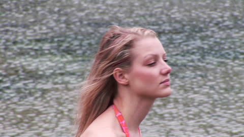 Young Woman Relaxing by Sparkling Water