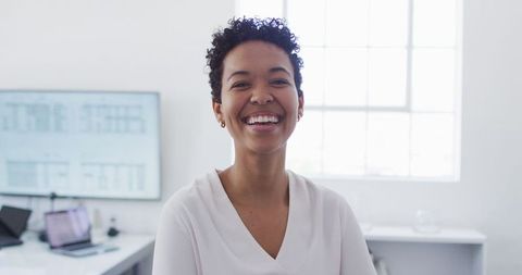 Smiling African American Businesswoman in Modern Office Environment