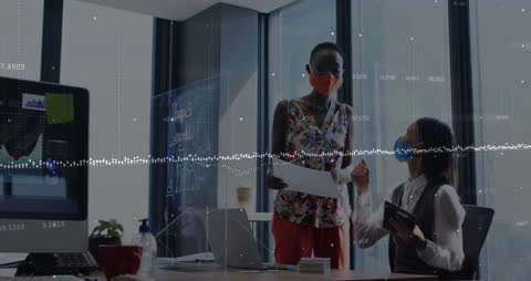 Diverse Colleagues Analyzing Financial Data While Wearing Masks