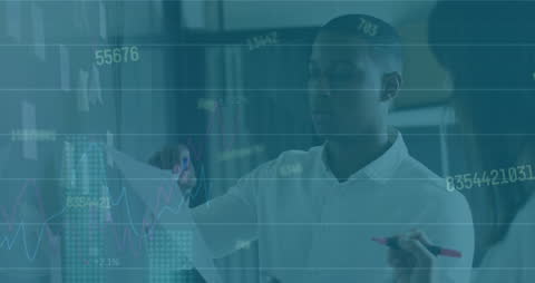 Business Professionals Analyzing Financial Graphs in Modern Office