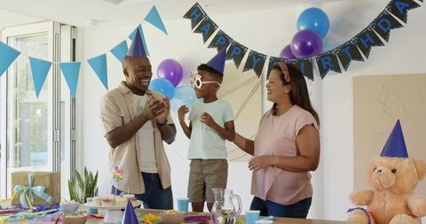 Happy Family Celebrating Birthday Party with Joy and Excitement