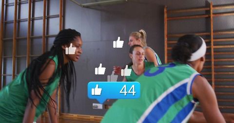 Dynamic female athletes discussing strategy with like icons in gym