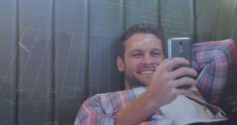 Man analyzing stock data on smartphone leisurely