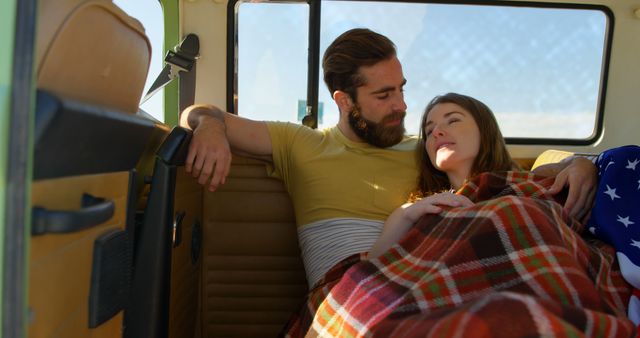 Young romantic couple relaxing in van. talking with each other 4k