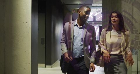 Business Professionals Walking Through Office Corridor with Digital Overlay